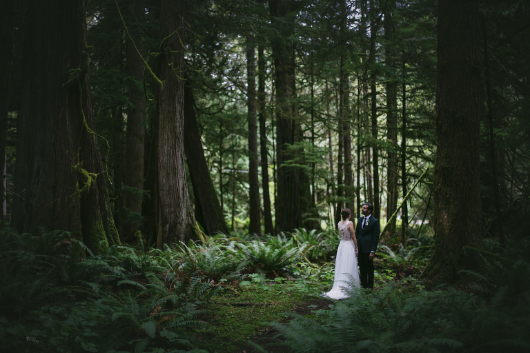 Bride and groom in woods