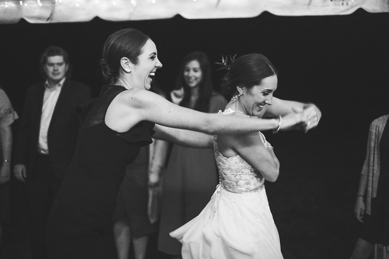 Bride and sister dancing
