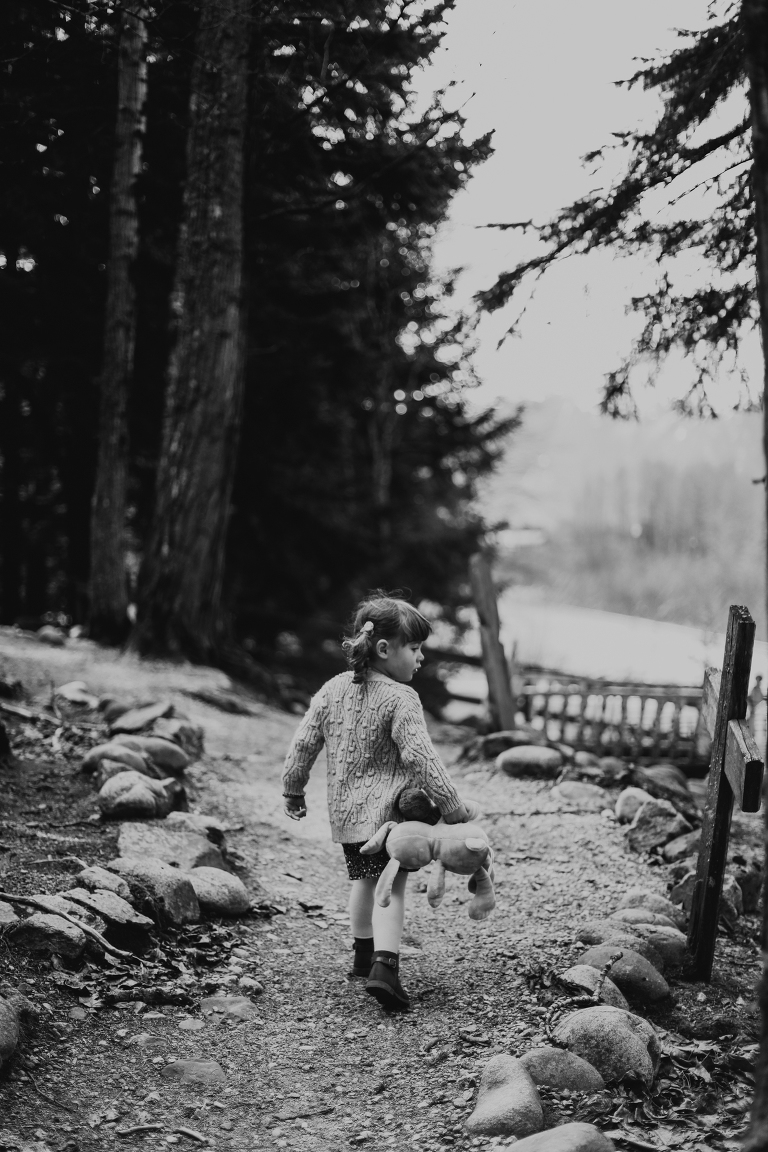 Little girl carries her bunny down a trail from Lower Reid Falls. 