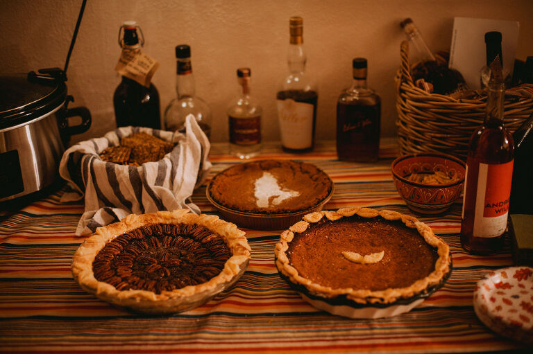 Thanksgiving pies sit on the dessert table. 