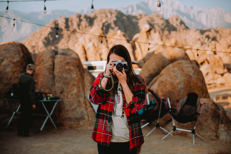 Kristi takes a photo with her Canon film camera in Alabama Hills the morning of their elopement. 
