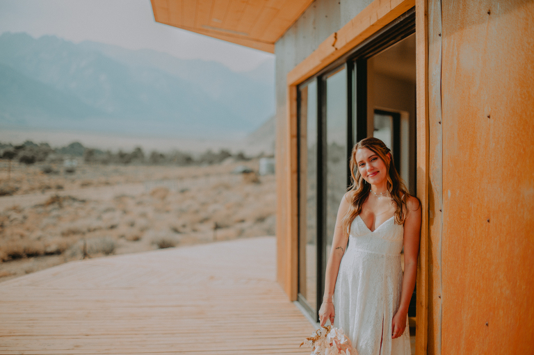 After putting on her dress, Kristi poses for a photo outside her Airbnb in Alabama Hills.